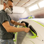 Technician preparing car for paint at Mathews Auto Body in Kennewick.