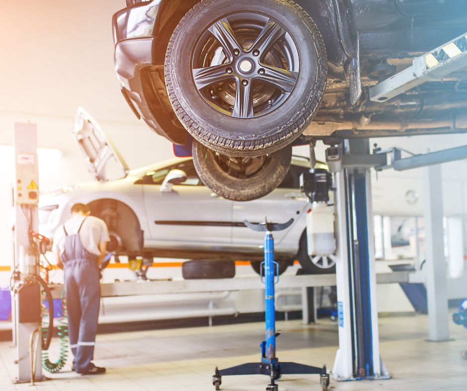 Mathews Auto Body technician in Tri-Cities working on suspension and collision repair.