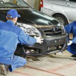 Team performing front bumper alignment and body work in Kennewick.