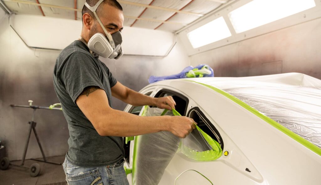 Technician preparing car for paint at Mathews Auto Body in Kennewick.